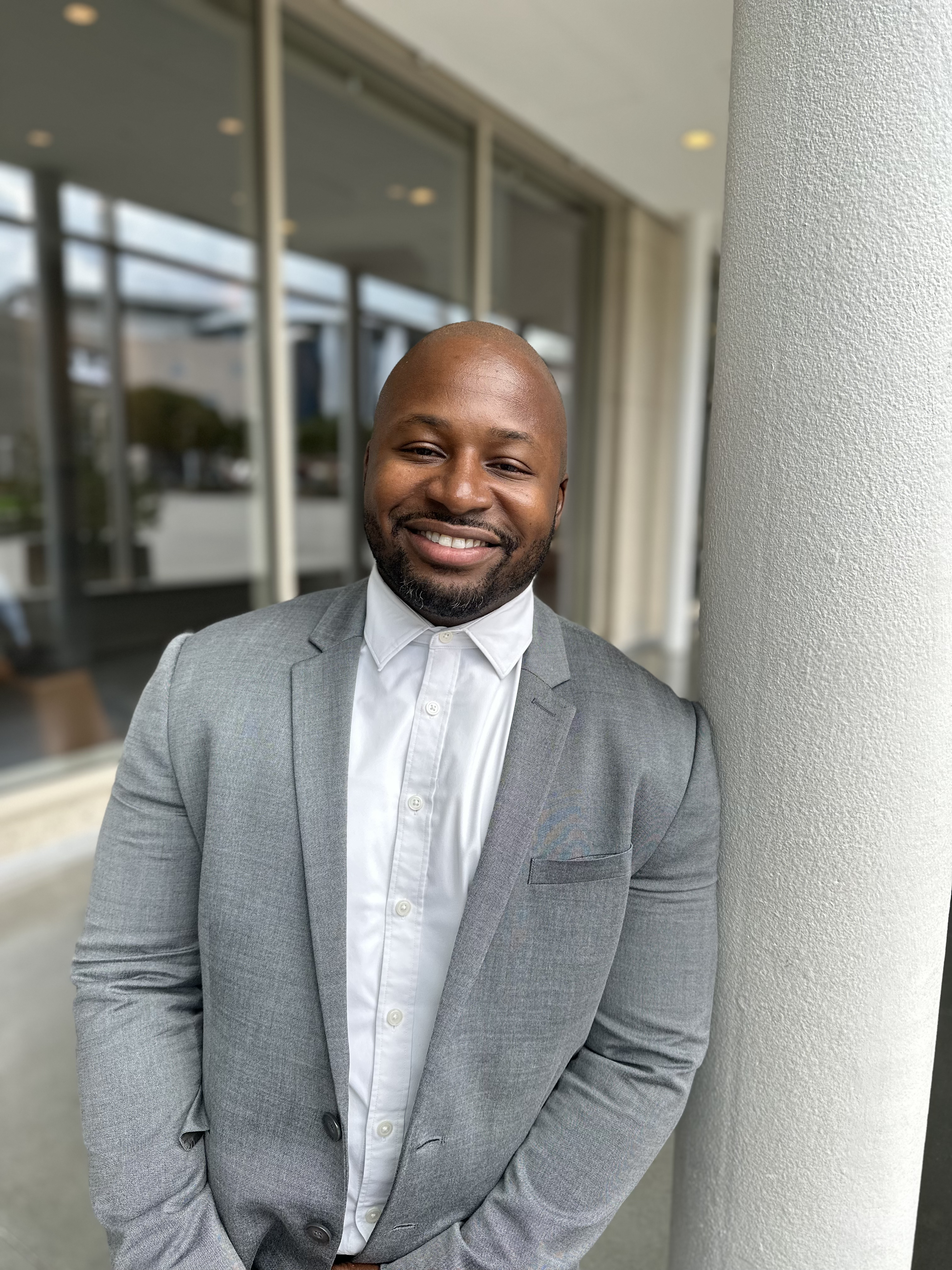 Jevon Wooden in gray suit.